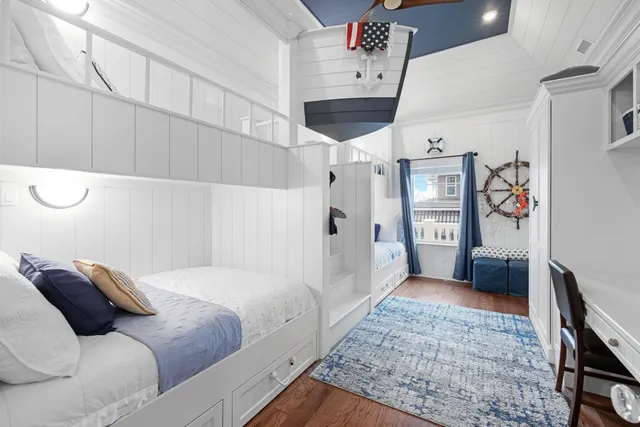 a bedroom with a bed and cabinets