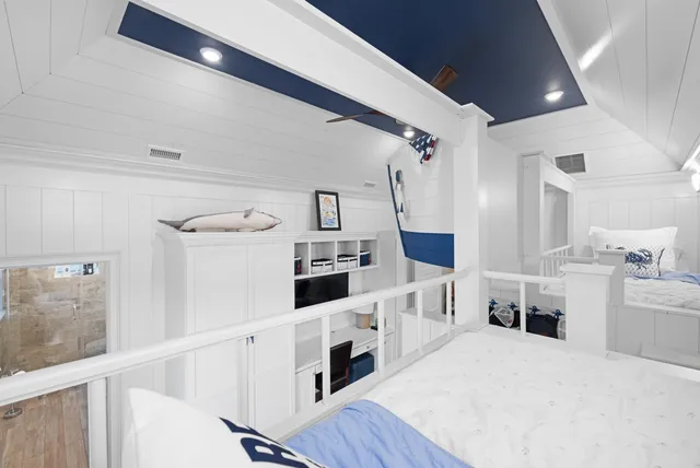 a kitchen with stainless steel appliances a white cabinets and a stove top oven