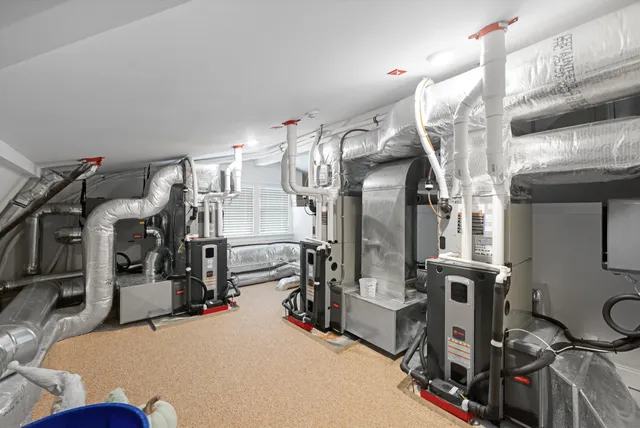 a dining room with furniture a rug and a large window