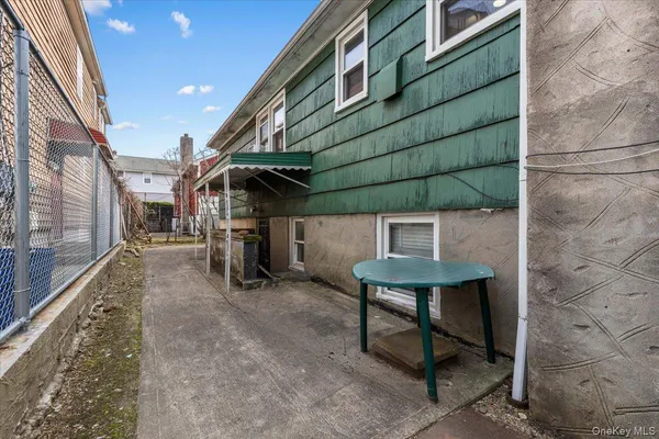 a view of a chairs and table in the patio