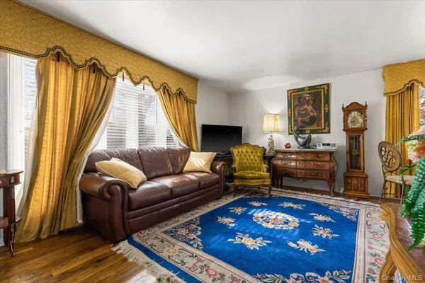 a living room with furniture and a rug