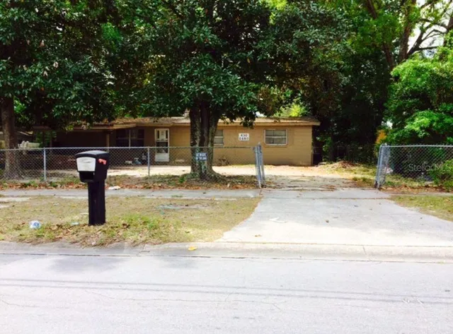 a swimming pool with outdoor seating and yard