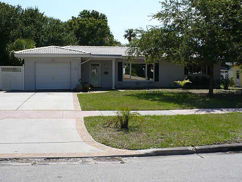 1721 Magnolia Road Belleair, FL 33756 - Photo 1 of 1 a view of a house with a backyard
