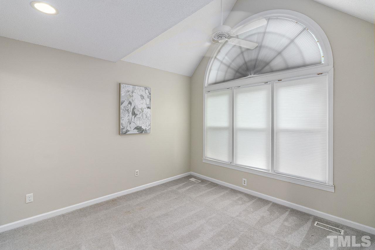 4704 Dillingham Court Raleigh, NC 27604 - Photo 7 of 10 Spacious room with large windows make this space bright and comfortable.