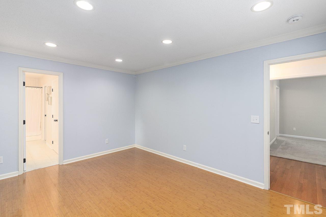 4704 Dillingham Court Raleigh, NC 27604 - Photo 8 of 10 Spacious first floor master bedroom makes main floor living a breeze.