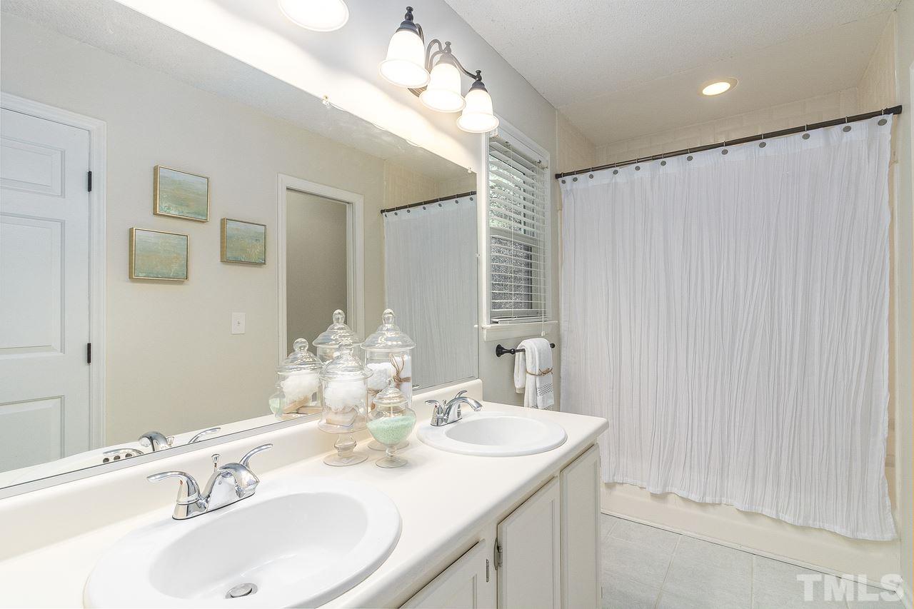 4704 Dillingham Court Raleigh, NC 27604 - Photo 9 of 10 Master bathroom features a double vanity