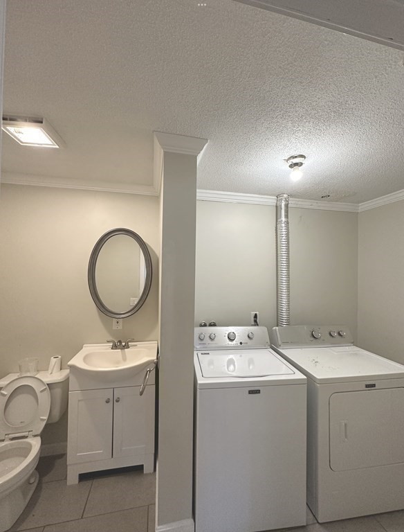 24 Emerson Street Springfield, MA 01118 - Photo 11 of 19 a bathroom with a toilet sink and mirror