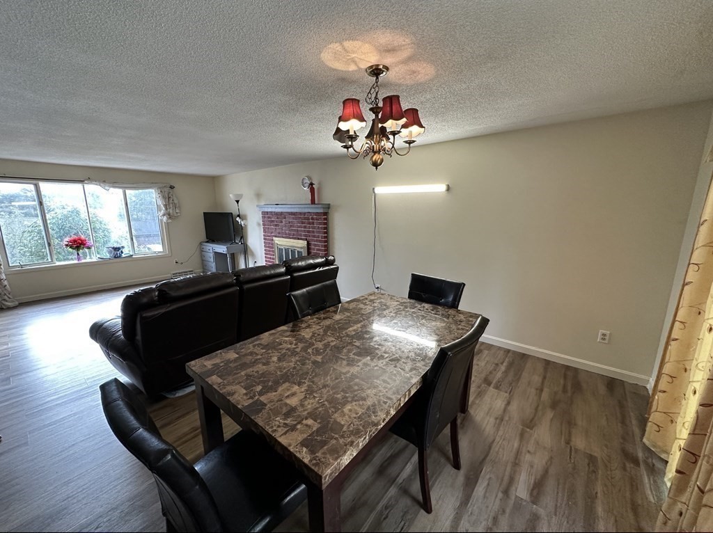 24 Emerson Street Springfield, MA 01118 - Photo 3 of 19 a view of a dining room with furniture and wooden floor