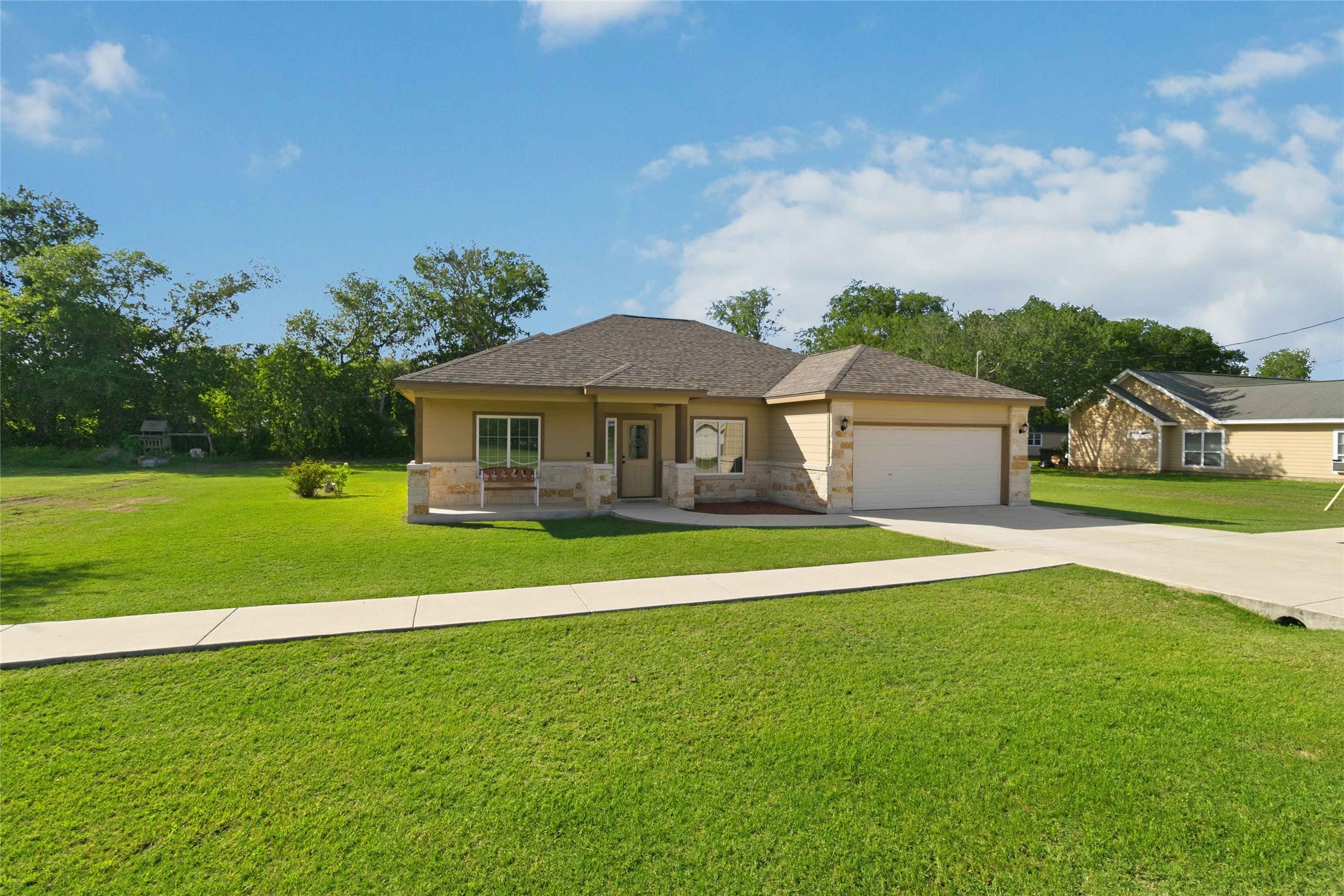 285 Hummingbird Way Martindale, TX 78655 - Photo 38 of 40 a front view of a house with a yard