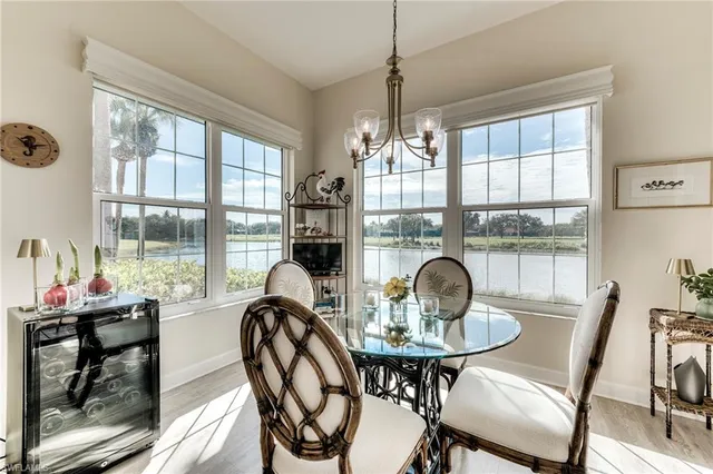 a dining room with furniture window and outside view