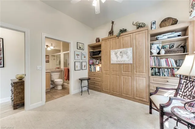 a bedroom with furniture and a book shelf