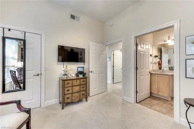 a view of a livingroom with furniture and cabinet