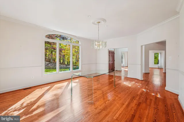 a spacious bathroom with a granite countertop sink and a mirror