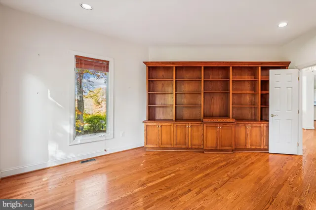 a view of a brick house with many windows