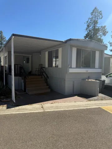 a view of swimming pool with an outdoor seating