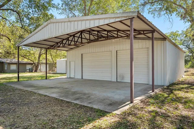 a backyard of a house with a shaded area