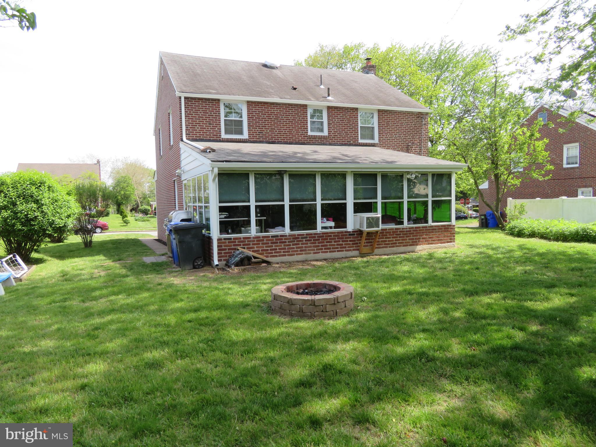 7630 Levis Road Cheltenham, PA 19012 - Photo 3 of 34 Rear of home featuring 3 season room.