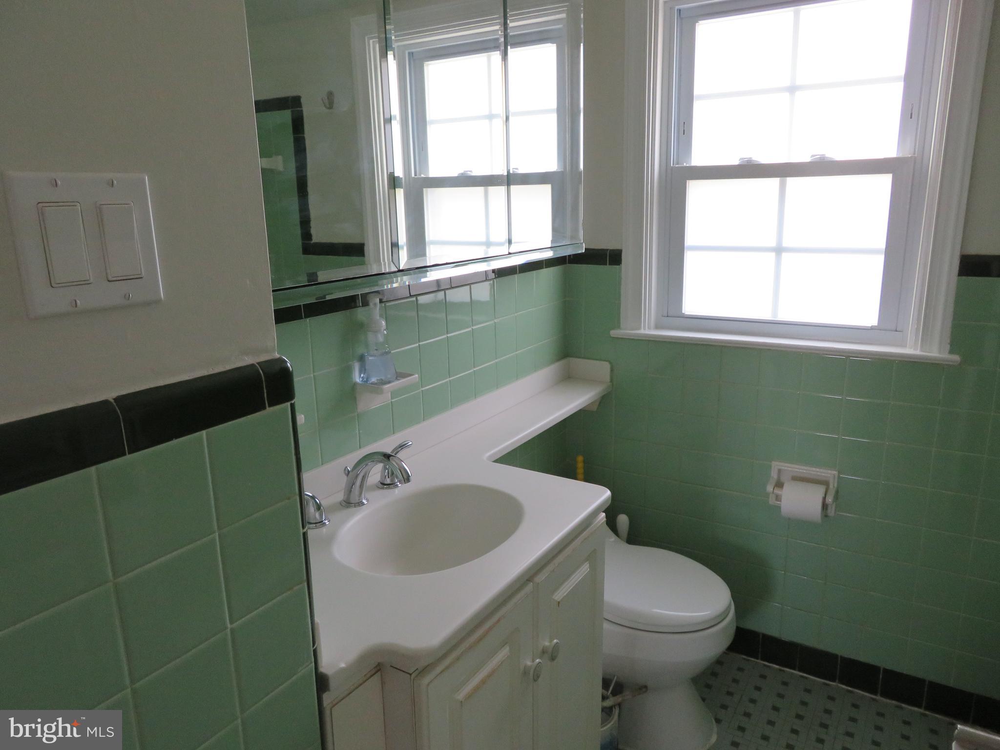 7630 Levis Road Cheltenham, PA 19012 - Photo 27 of 34 Hall bath with perfect original tile.