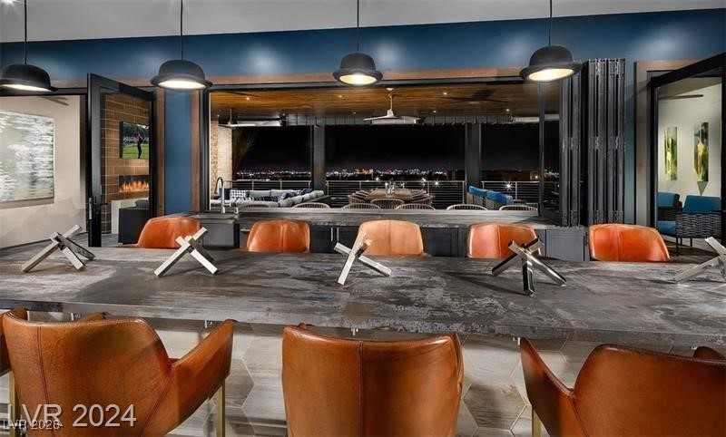 4151 Solace Street Las Vegas, NV 89135 - Photo 47 of 51 Bar area featuring hanging light fixtures and a sink