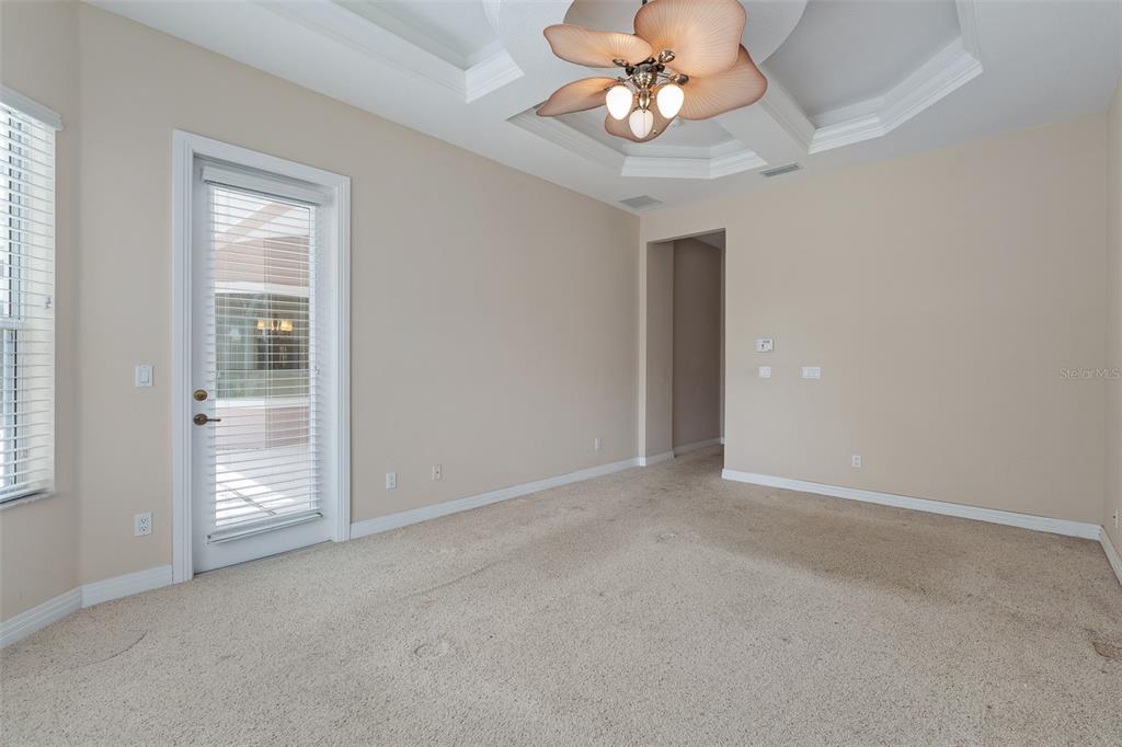 19 Lakeview Lane Palm Coast, FL 32137 - Photo 26 of 81 an empty room with chandelier fan and windows