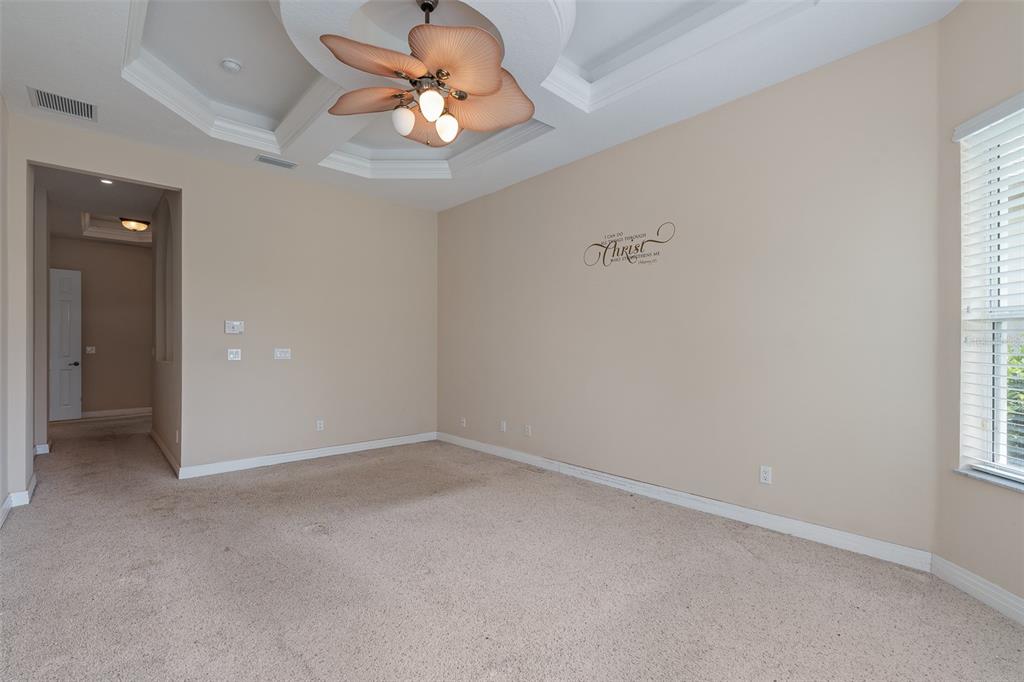 19 Lakeview Lane Palm Coast, FL 32137 - Photo 27 of 81 an empty room that has a chandelier fan and a window