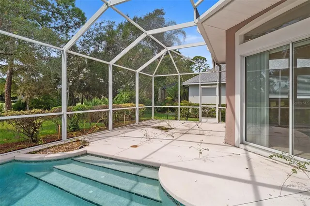 a view of an empty room with a large window