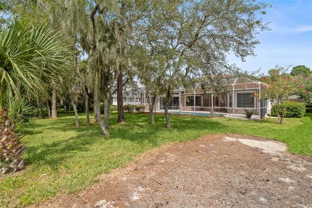 a kitchen with stainless steel appliances granite countertop a refrigerator a stove top oven a sink and dishwasher
