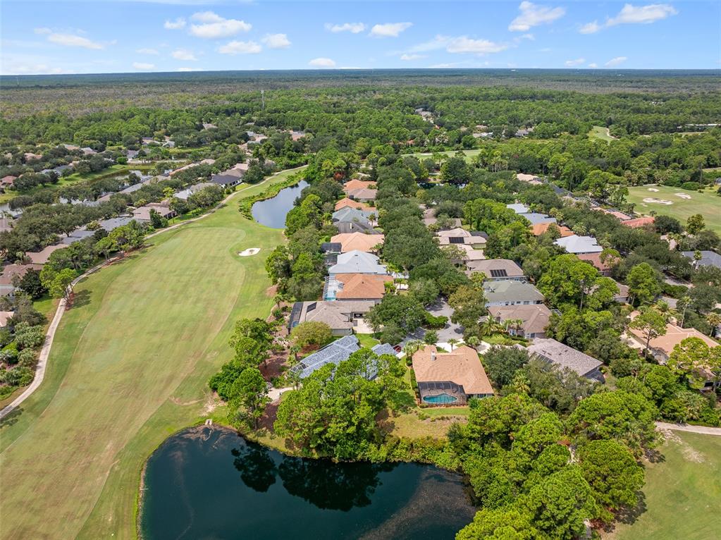 19 Lakeview Lane Palm Coast, FL 32137 - Photo 4 of 81 an aerial view of residential houses with outdoor space and trees