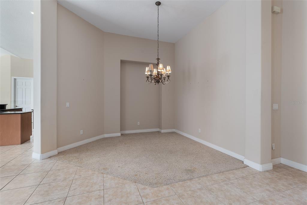 19 Lakeview Lane Palm Coast, FL 32137 - Photo 53 of 81 a view of a chandelier fan and refrigerator