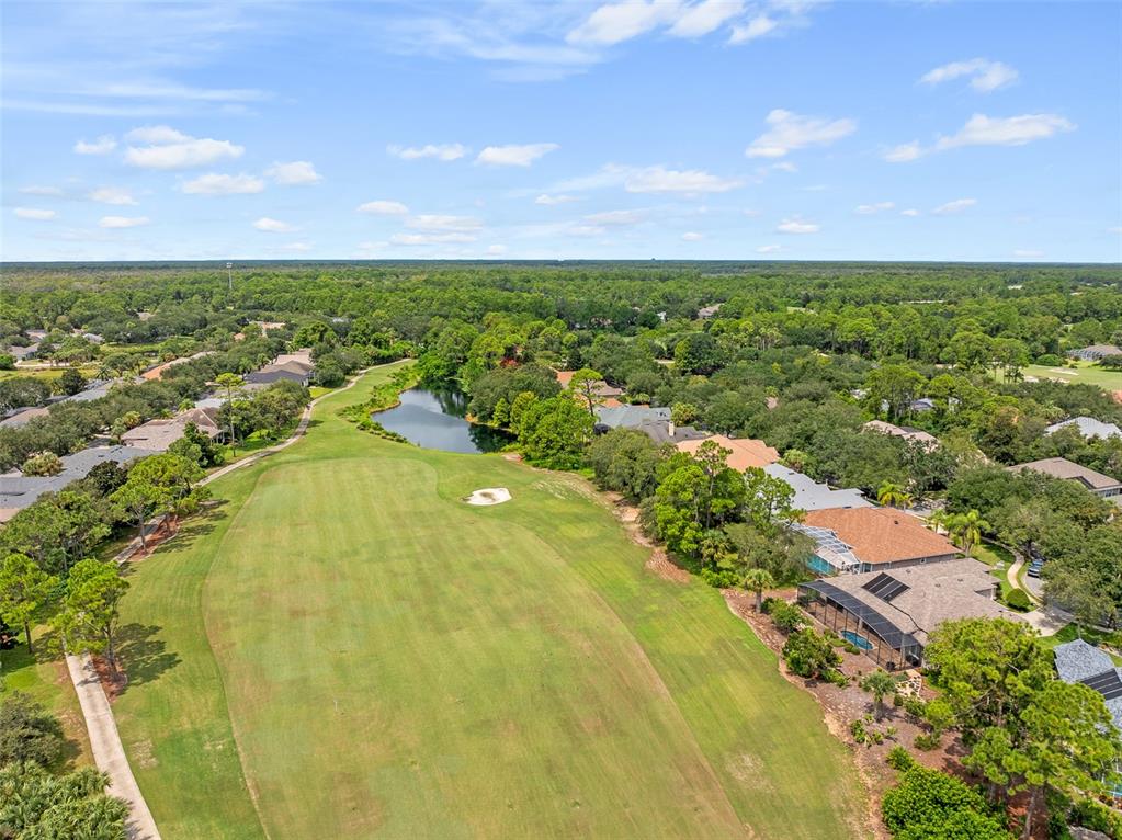 19 Lakeview Lane Palm Coast, FL 32137 - Photo 7 of 81 an aerial view of residential houses with outdoor space and trees all around