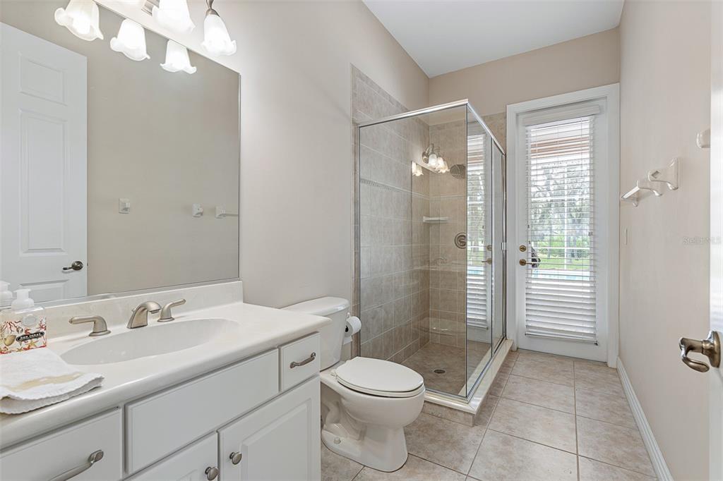 19 Lakeview Lane Palm Coast, FL 32137 - Photo 74 of 81 a bathroom with a sink a toilet and shower