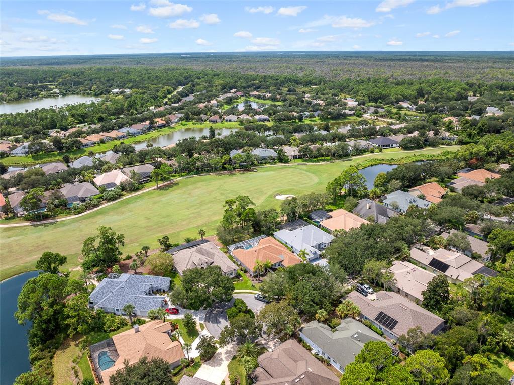 19 Lakeview Lane Palm Coast, FL 32137 - Photo 10 of 81 an aerial view of city and lake