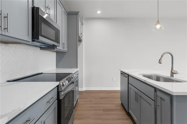 a bathroom with a sink toilet vanity and shower