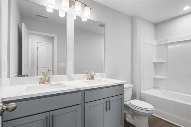 a bathroom with a sink and a large mirror