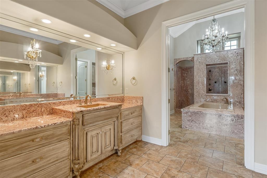 20389 County Road 178 Flint, TX 75762 - Photo 26 of 40 Dual vanity with light wood-finish cabinetry and granite countertops