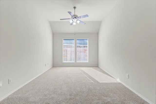 a view of patio with a table and chairs under an umbrella