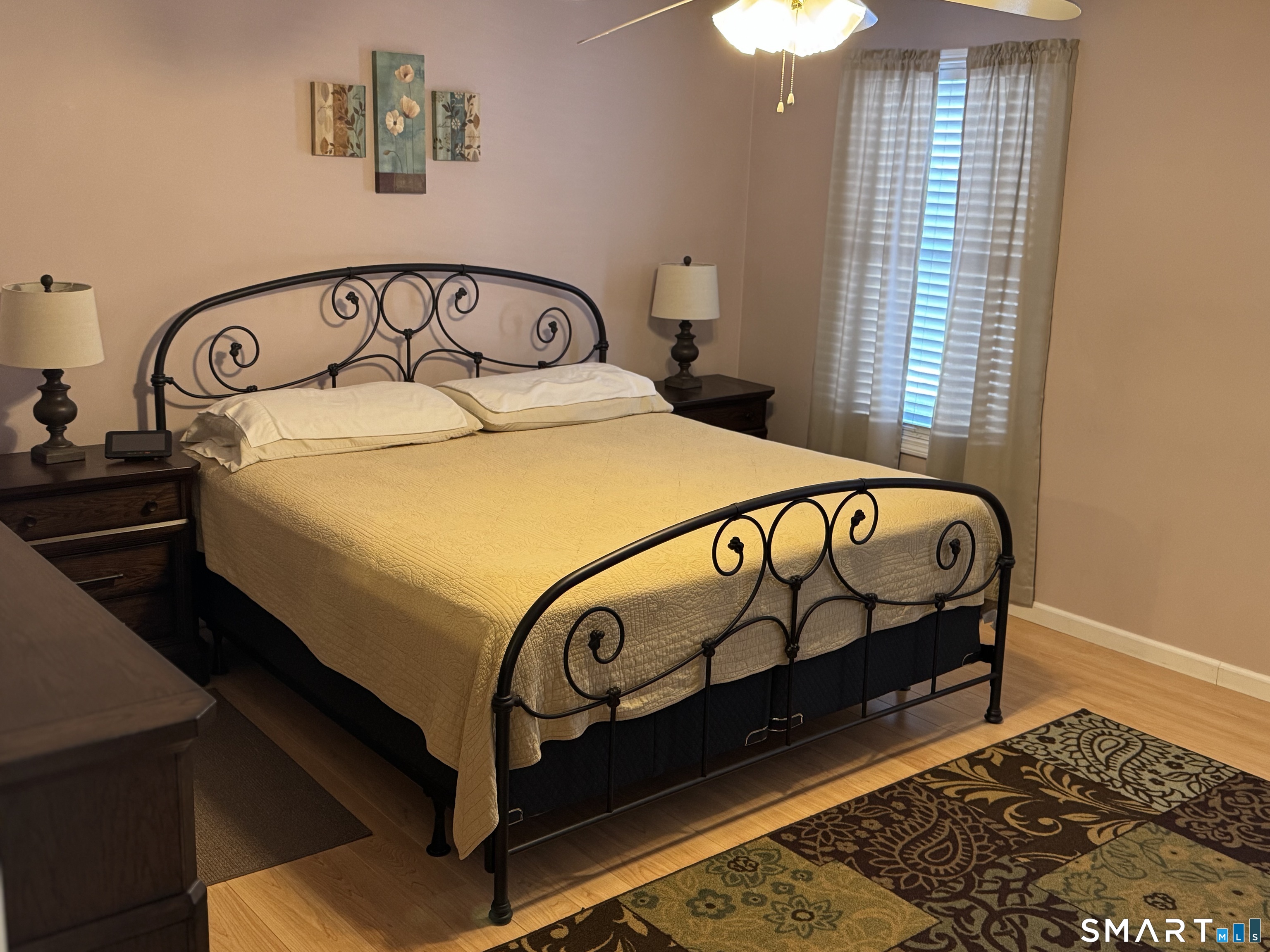 7 Bay Path Way, Unit 7 Branford, CT 06405 - Photo 11 of 14 a bed sitting in a bedroom next to a window