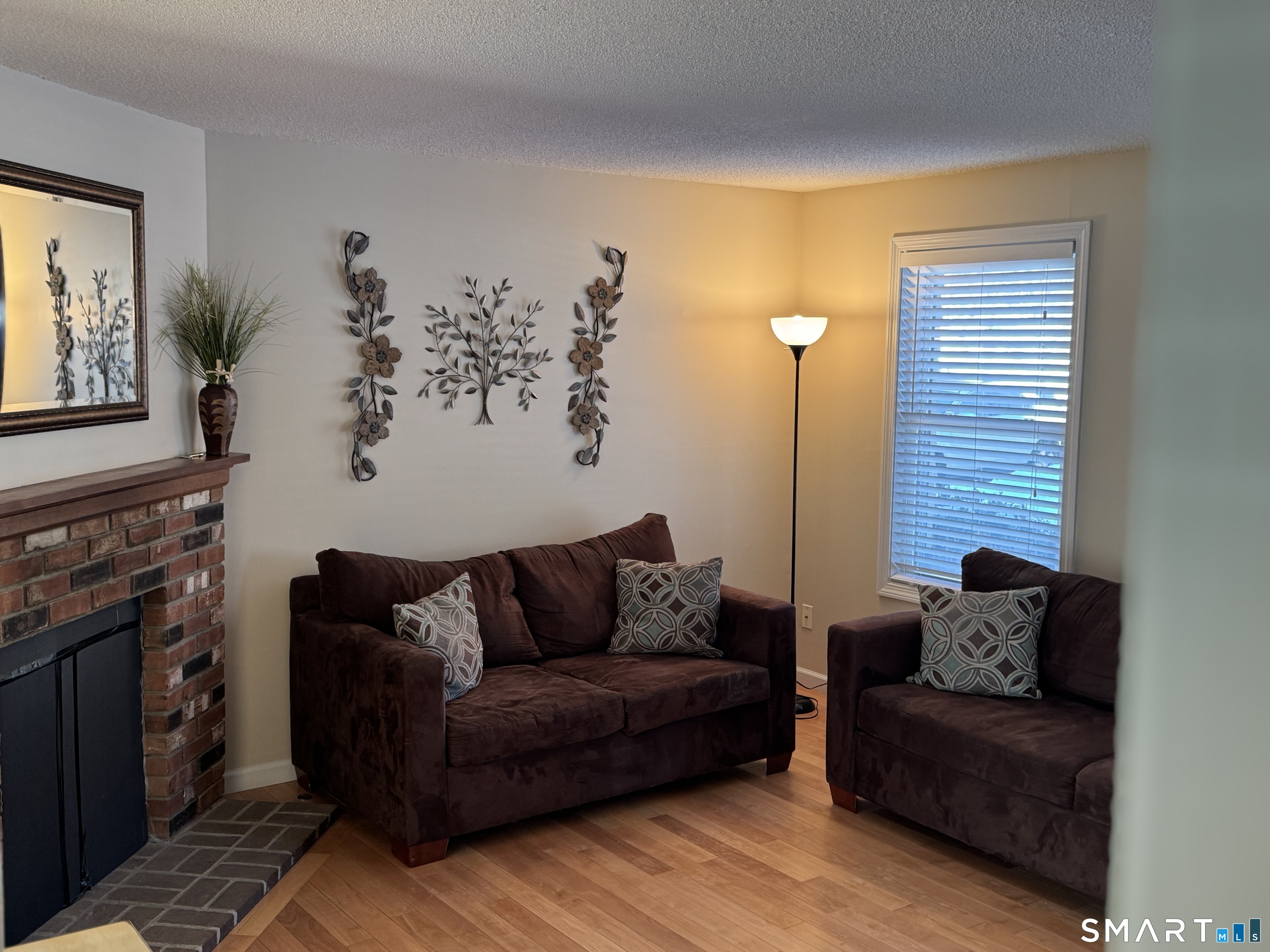 7 Bay Path Way, Unit 7 Branford, CT 06405 - Photo 2 of 14 a living room with furniture and a flat screen tv