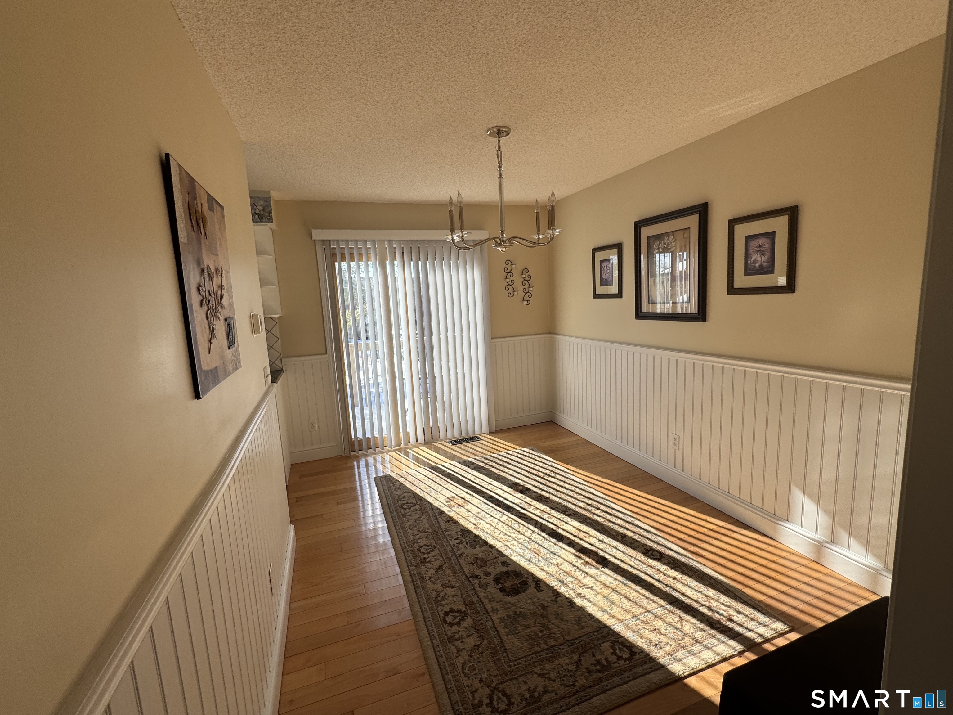 7 Bay Path Way, Unit 7 Branford, CT 06405 - Photo 3 of 14 a view of a hallway with stairs and a chandelier