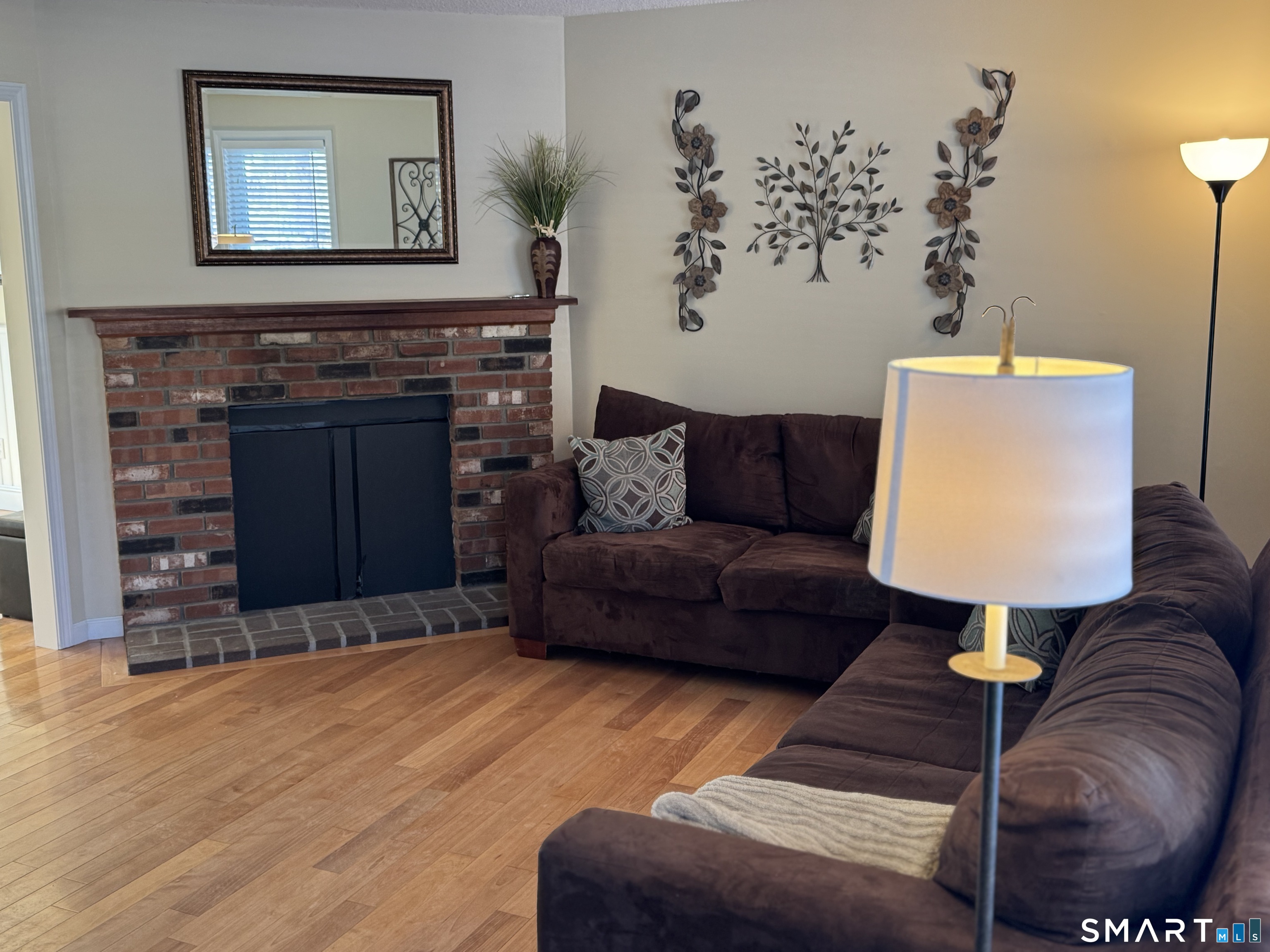 7 Bay Path Way, Unit 7 Branford, CT 06405 - Photo 5 of 14 a living room with furniture and a fireplace