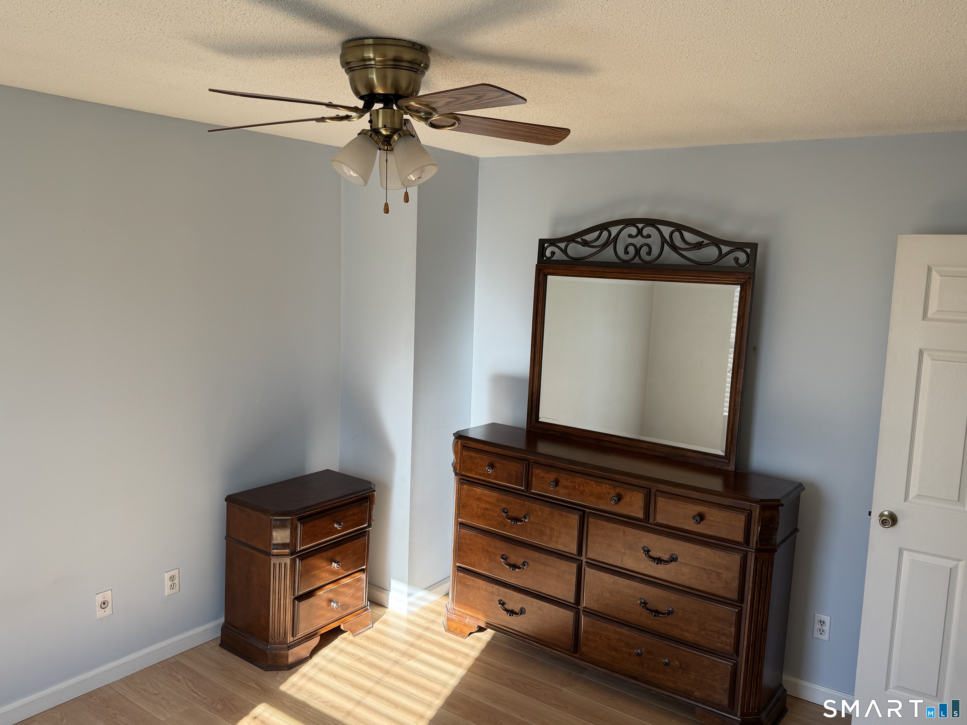 7 Bay Path Way, Unit 7 Branford, CT 06405 - Photo 10 of 14 a view of room with wooden floor and cabinet