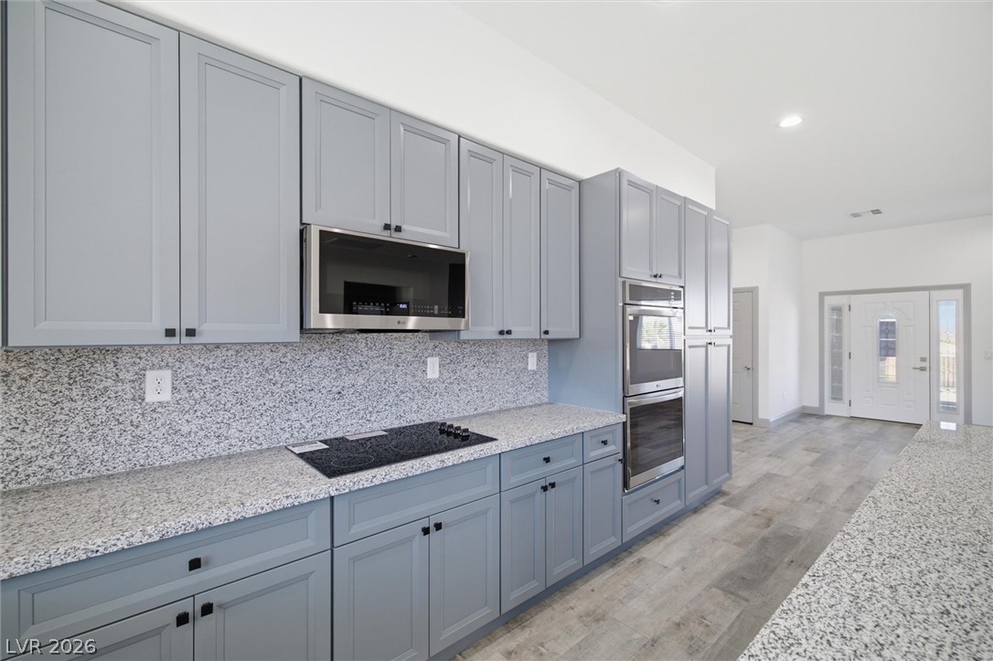 1061 Factory Road Pahrump, NV 89048 - Photo 14 of 41 Culinary delights await in this modern kitchen with extensive counter space and efficient appliances.