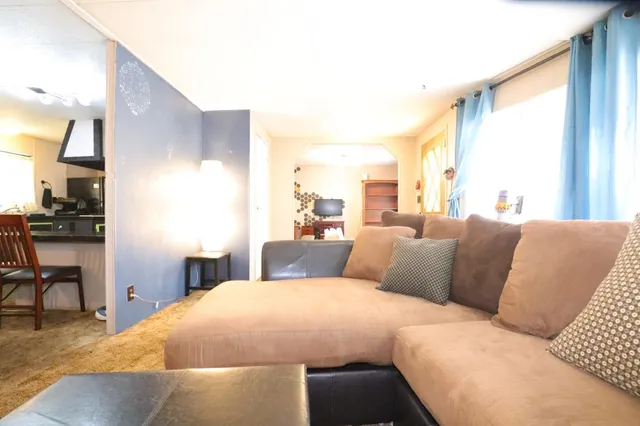 a bedroom with a large bed and a large window