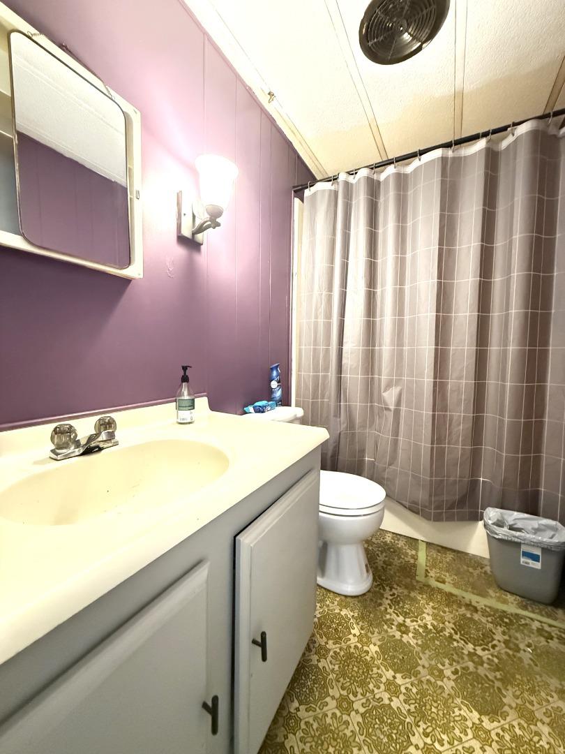 5450 Monterey Road, Unit 143 San Jose, CA 95111 - Photo 5 of 21 a bathroom with a granite countertop sink and a mirror