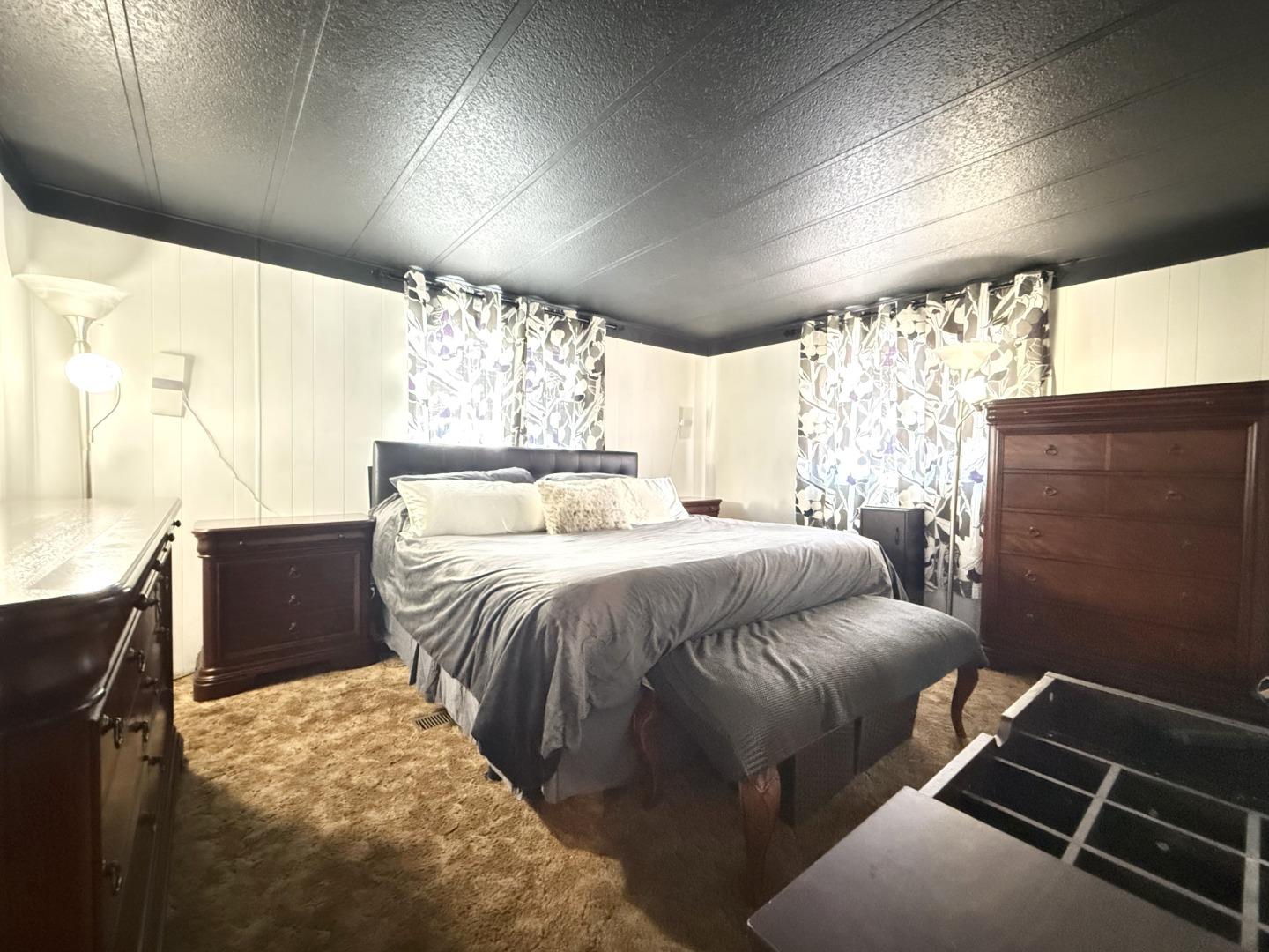 5450 Monterey Road, Unit 143 San Jose, CA 95111 - Photo 6 of 21 a bedroom with a bed and wooden floor