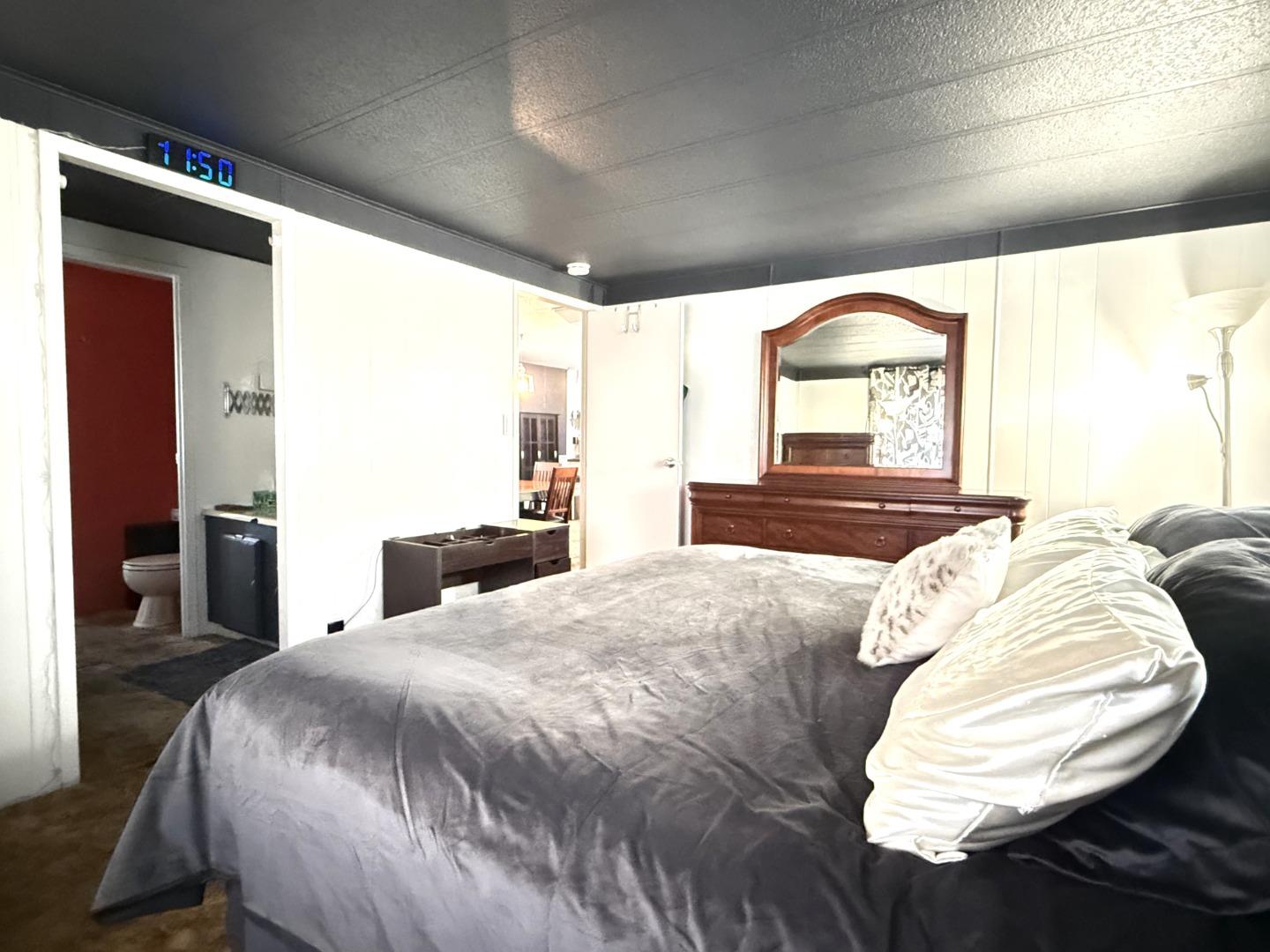 5450 Monterey Road, Unit 143 San Jose, CA 95111 - Photo 8 of 21 a bed sitting in a bedroom next to a window