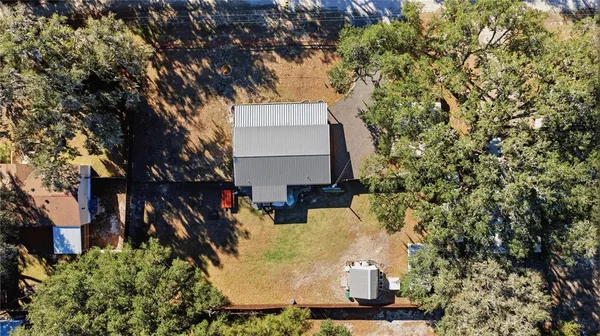 front view of a house with a tree