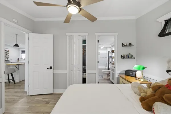 a bedroom with a bed and a dresser