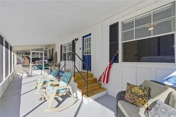 a view of a house with backyard and a garden