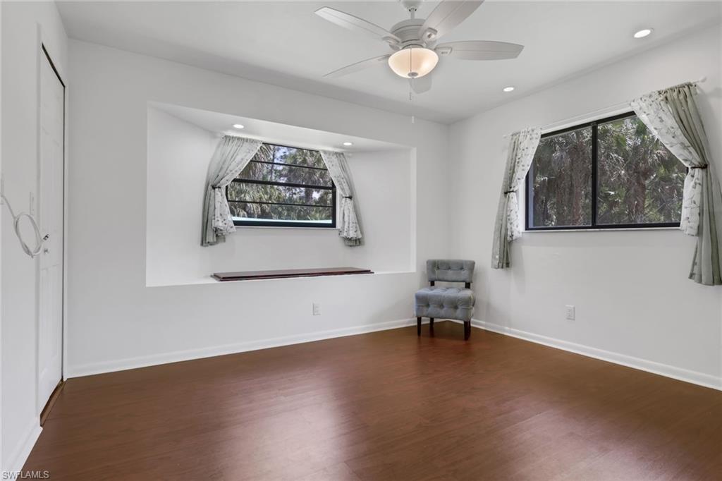 760 1st Street Northwest Naples, FL 34120 - Photo 14 of 36 a view of a workspace with furniture and a ceiling fan
